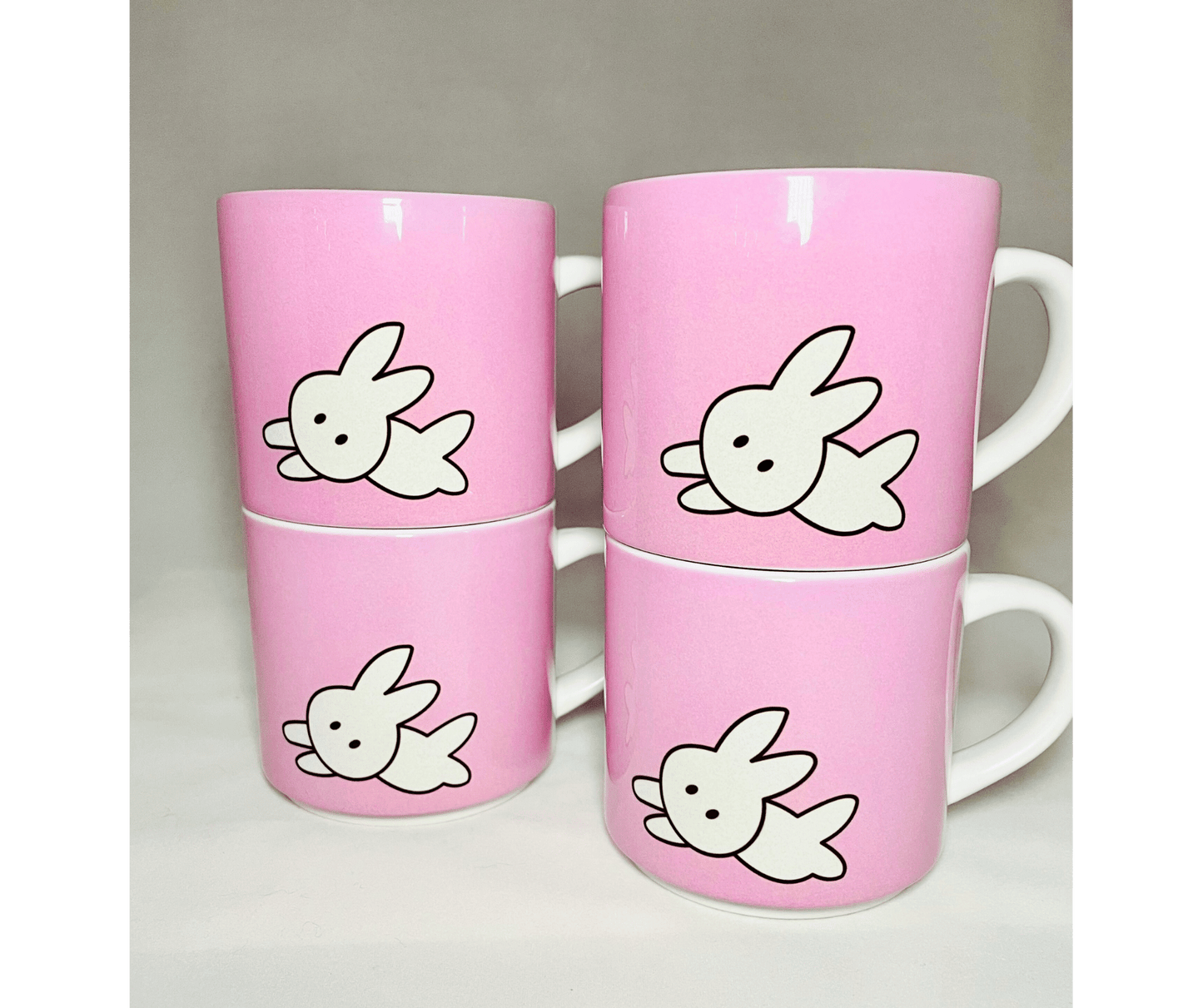 kawaii bunny mugs. 4 pink stackable 10 oz coffee mugs on white background
